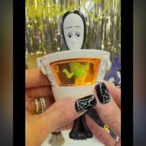 Wednesday Addams from the 2019 animated movie Light Up Frog Moving Toy